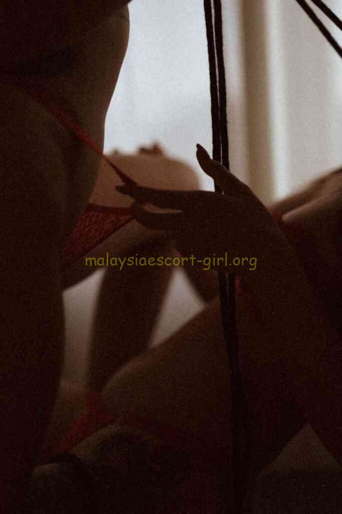 Viola and Cici in intimate embrace, suggestive of a threesome, KL Girl Service