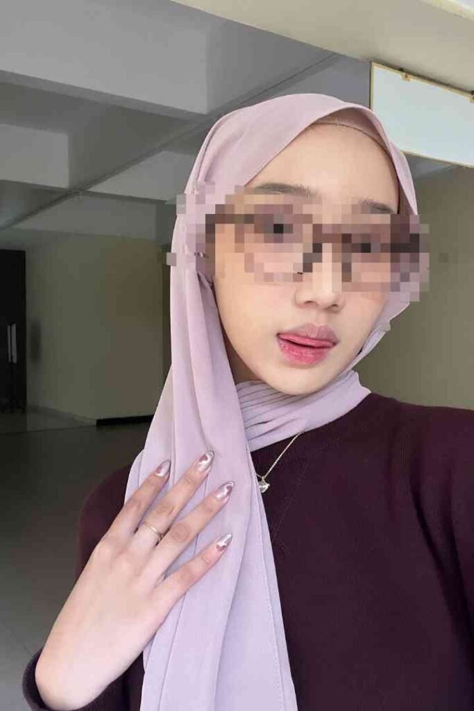 KL Escort Girl in purple hijab posing for camera, blurred face